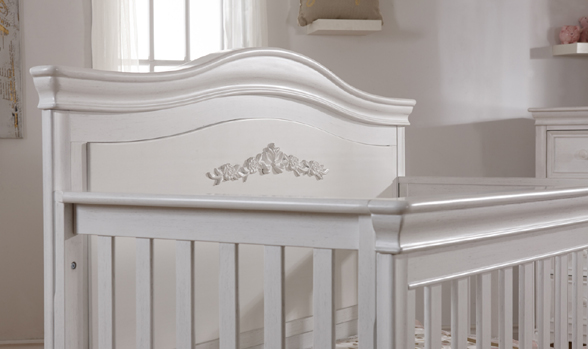 The <b>2403 Diamante Forever Crib</b> features a full panel headboard with a gorgeus <b>floral decor</b>.