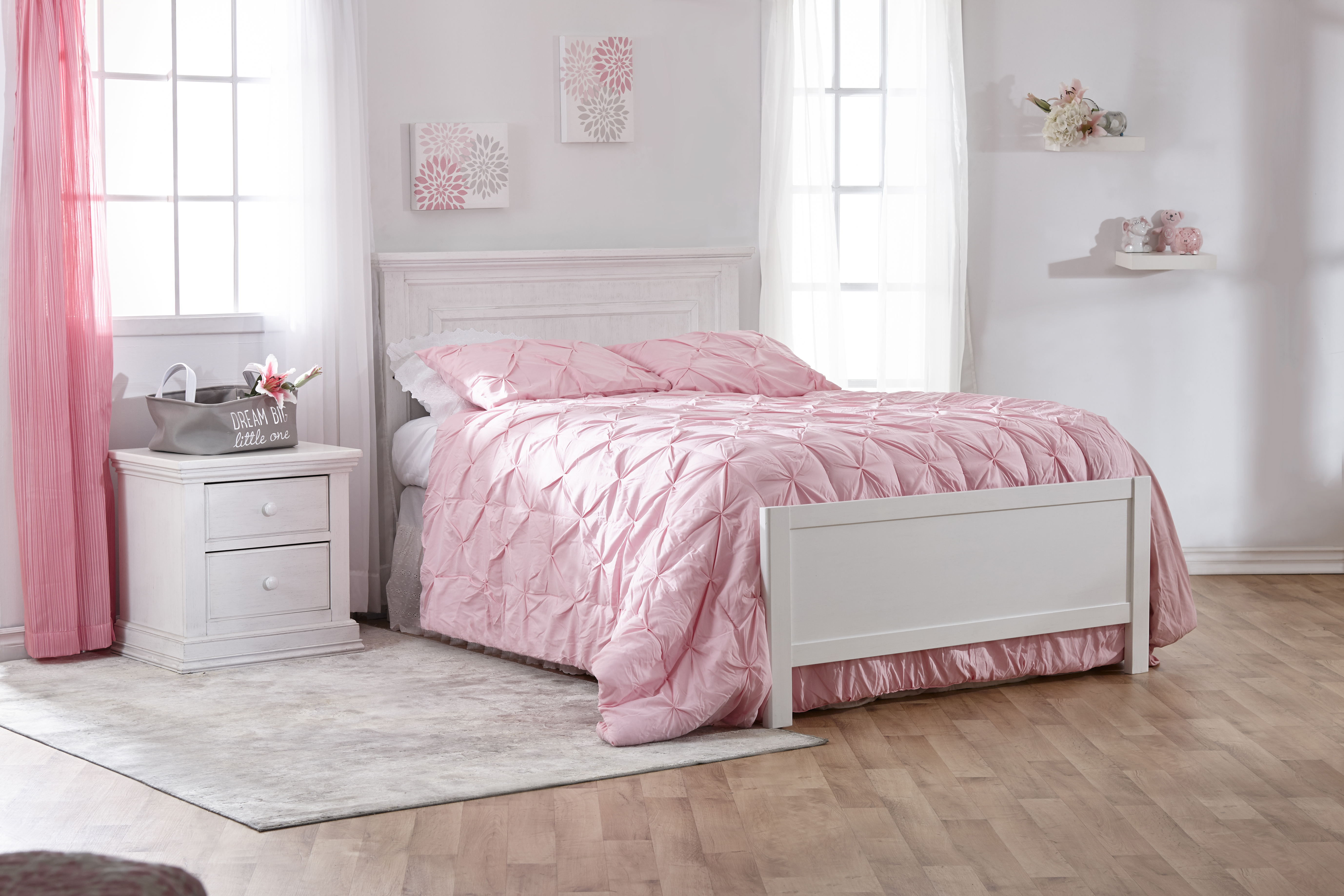 The <b>Modena Forever Crib</b>, converted into a <b>full-size bed</b>, with the Low Profile Footboard (sold separately), in Vintage White.