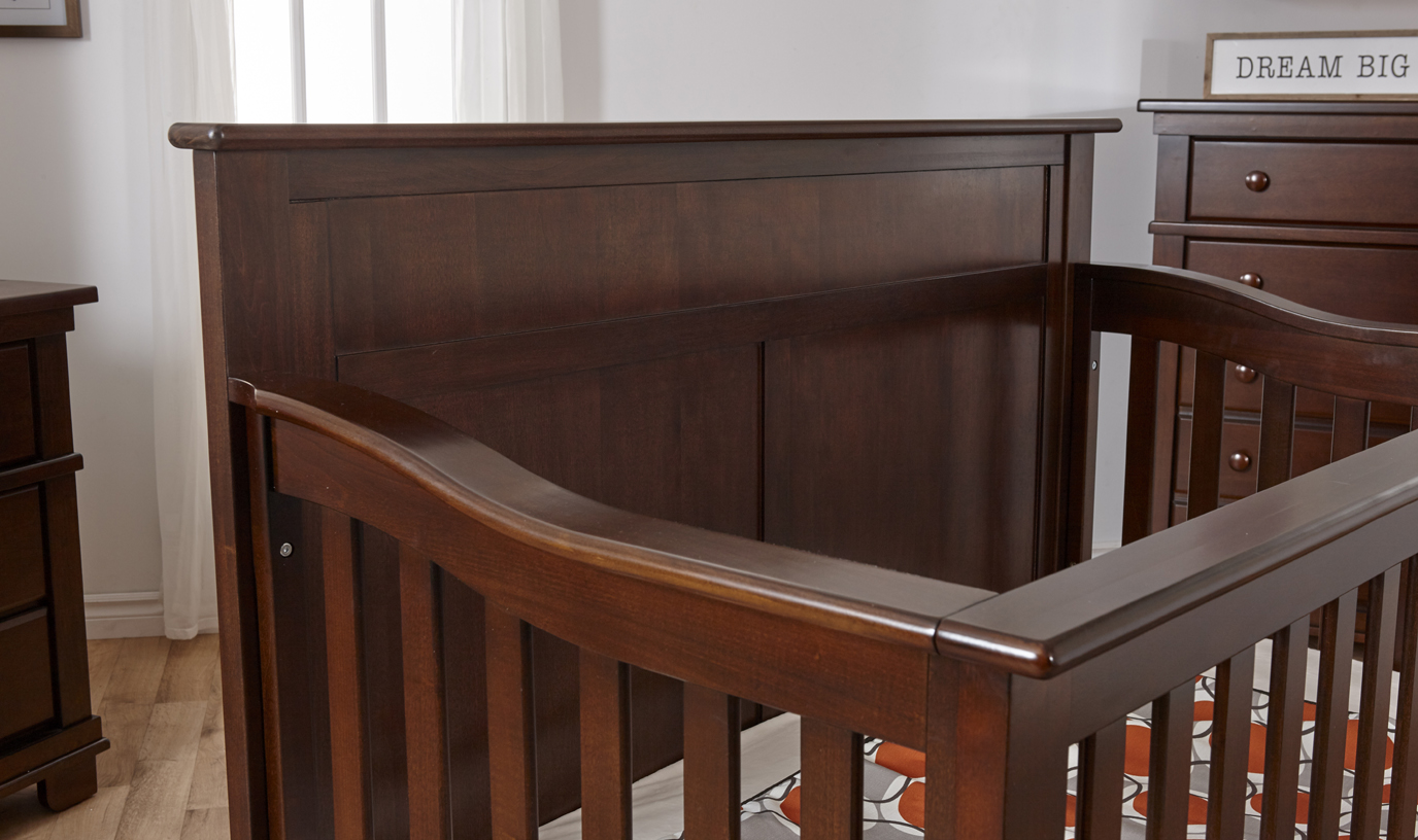 A detail of the Napoli Forever Crib with Flat-Top Headboard, in Mocacchino.