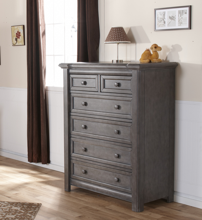 The 2205 <b>Cristallo 5-Drawer Dresser</b> in Granite. <br>This classically styled 5-Drawer Dresser is a perfect complement to your little one’s sweetly styled haven.  The layered lines and curved moldings that surround the top edge of this dresser reflect both elegance and refinement with a little bit of flare.  With four large soft-closing drawers and two small ones at the top, this piece has plenty of storage space and allows for you to carefully tuck away both small and more bulky items, all while keeping fragile belongings out of reach.  Like the rest of the Cristallo Collection, the Cristallo 5-Drawer Dresser, is full of texture and shine, providing both elegance and space to store the precious things that belong to the light of your life.  <br>