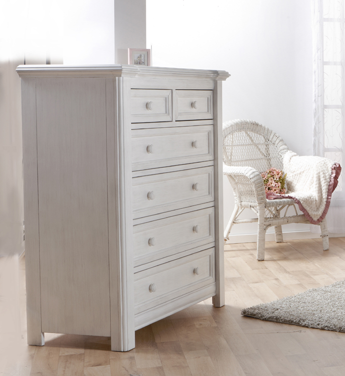 The 2205 <b>Cristallo 5-Drawer Dresser</b> in Vintage White. <br>This classically styled 5-Drawer Dresser is a perfect complement to your little one’s sweetly styled haven.  The layered lines and curved moldings that surround the top edge of this dresser reflect both elegance and refinement with a little bit of flare.  With four large soft-closing drawers and two small ones at the top, this piece has plenty of storage space and allows for you to carefully tuck away both small and more bulky items, all while keeping fragile belongings out of reach.  Like the rest of the Cristallo Collection, the Cristallo 5-Drawer Dresser, is full of texture and shine, providing both elegance and space to store the precious things that belong to the light of your life.  <br>