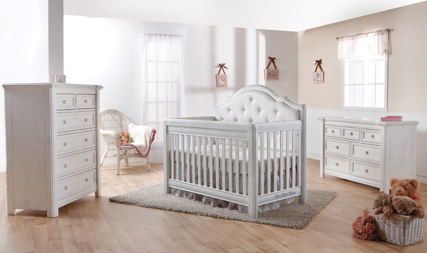 The 2202 <b>Cristallo Forever Crib</b> in Vintage White. This latest addtion to the Cristallo collection features a <i>white</i> vinyl upholstered panel headboard.