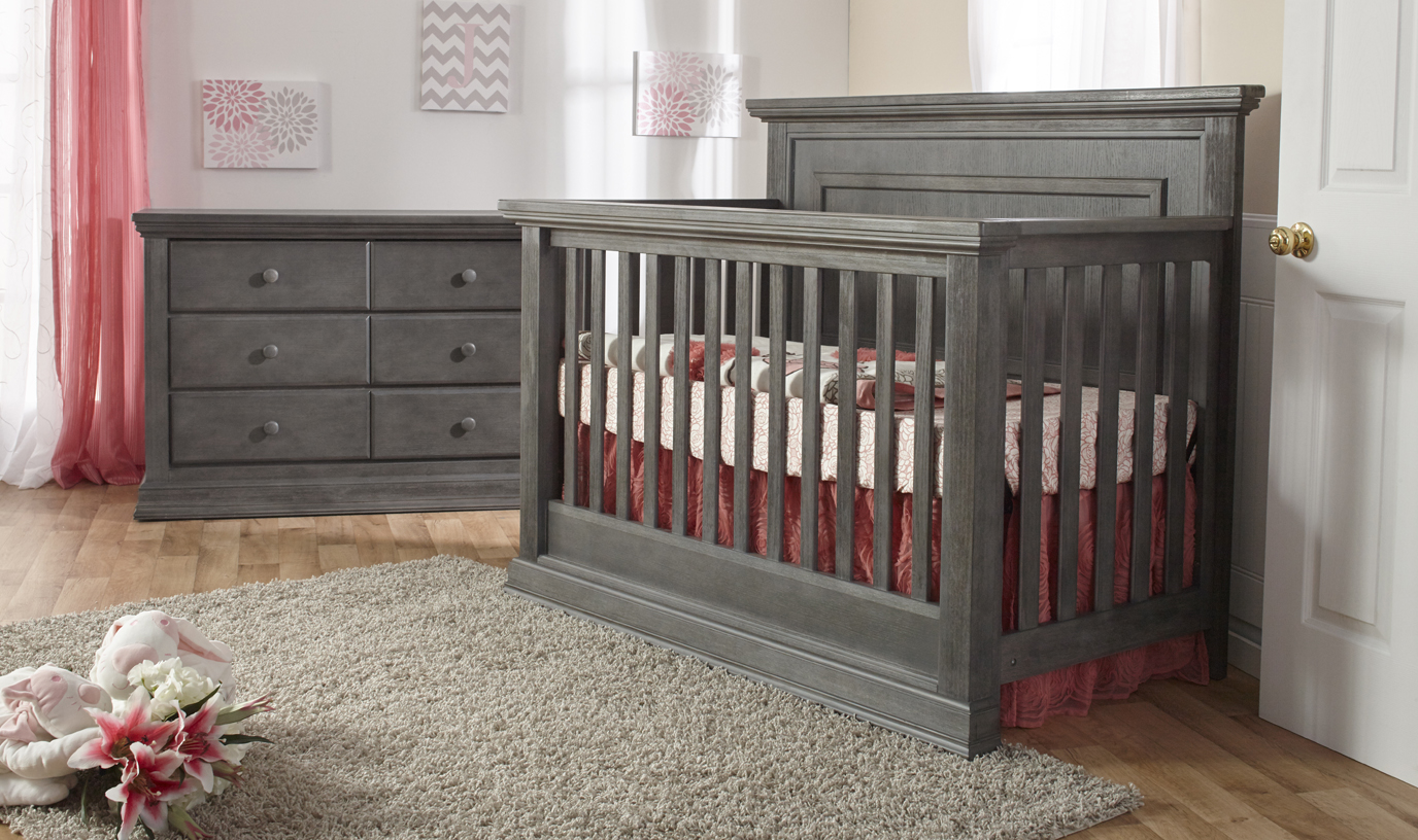 The gorgeous <b>Modena Forever Crib</b> with a <b>2106 Double Dresser</b>, and a <b>2105 5 Drawer Dresser</b>, in Distressed Granite.
