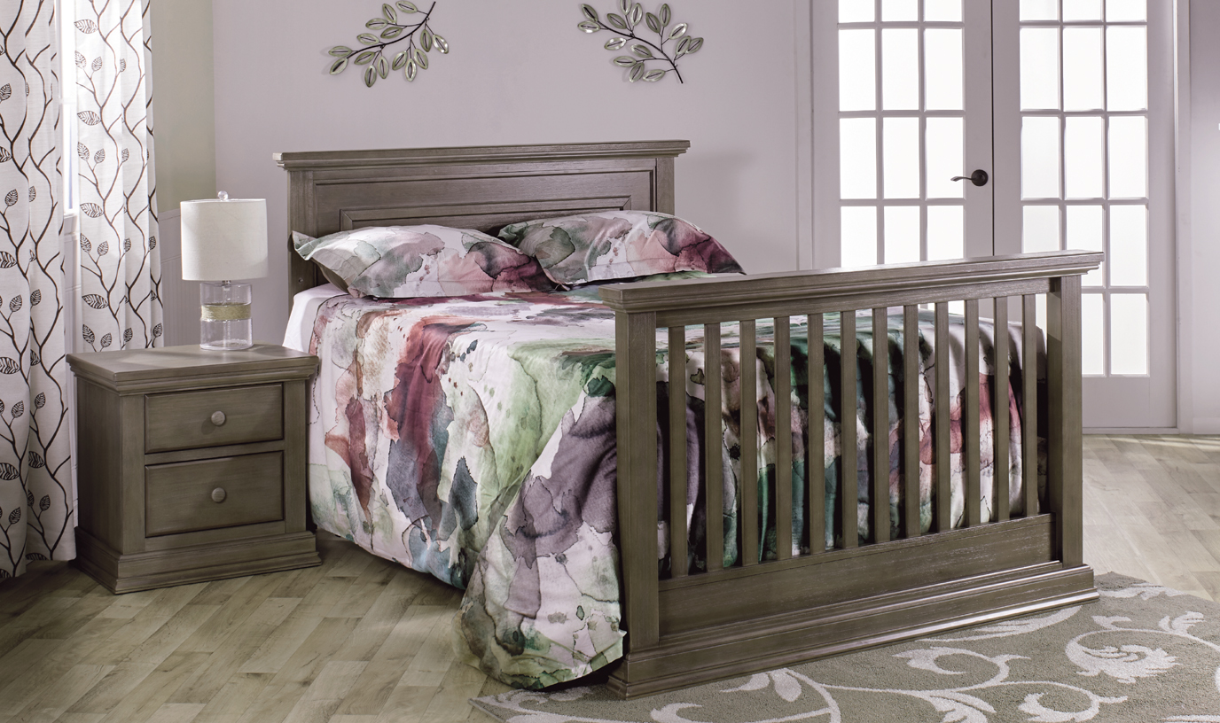 The <b>Modena Forever Crib</b>, converted into a <b>full-size bed</b>, in Distressed Desert.