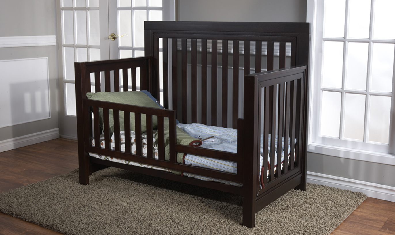 <b>Novara Toddler Bed</b>, in Vintage Cherry.  The Novara Crib can convert into a toddler bed with the purchase of a <b>Toddler Rail</b> (sold separately).  It can also convert into a full-size bed (with the purchase of the Universal Rails, sold separately).